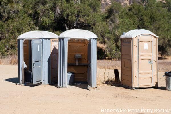 a clean row of portable restrooms for outdoor weddings or festivals in Owyhee, NV